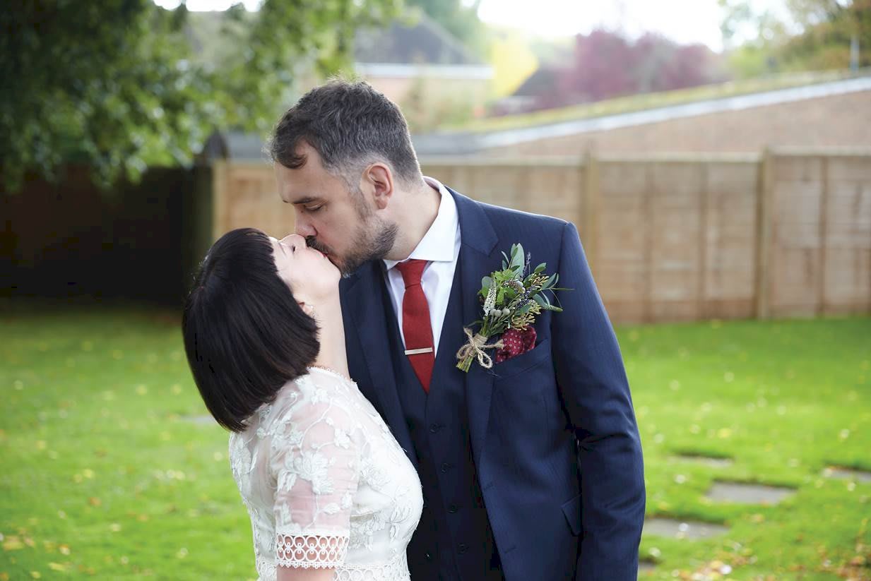 Real Wedding Hannah and James Kissing