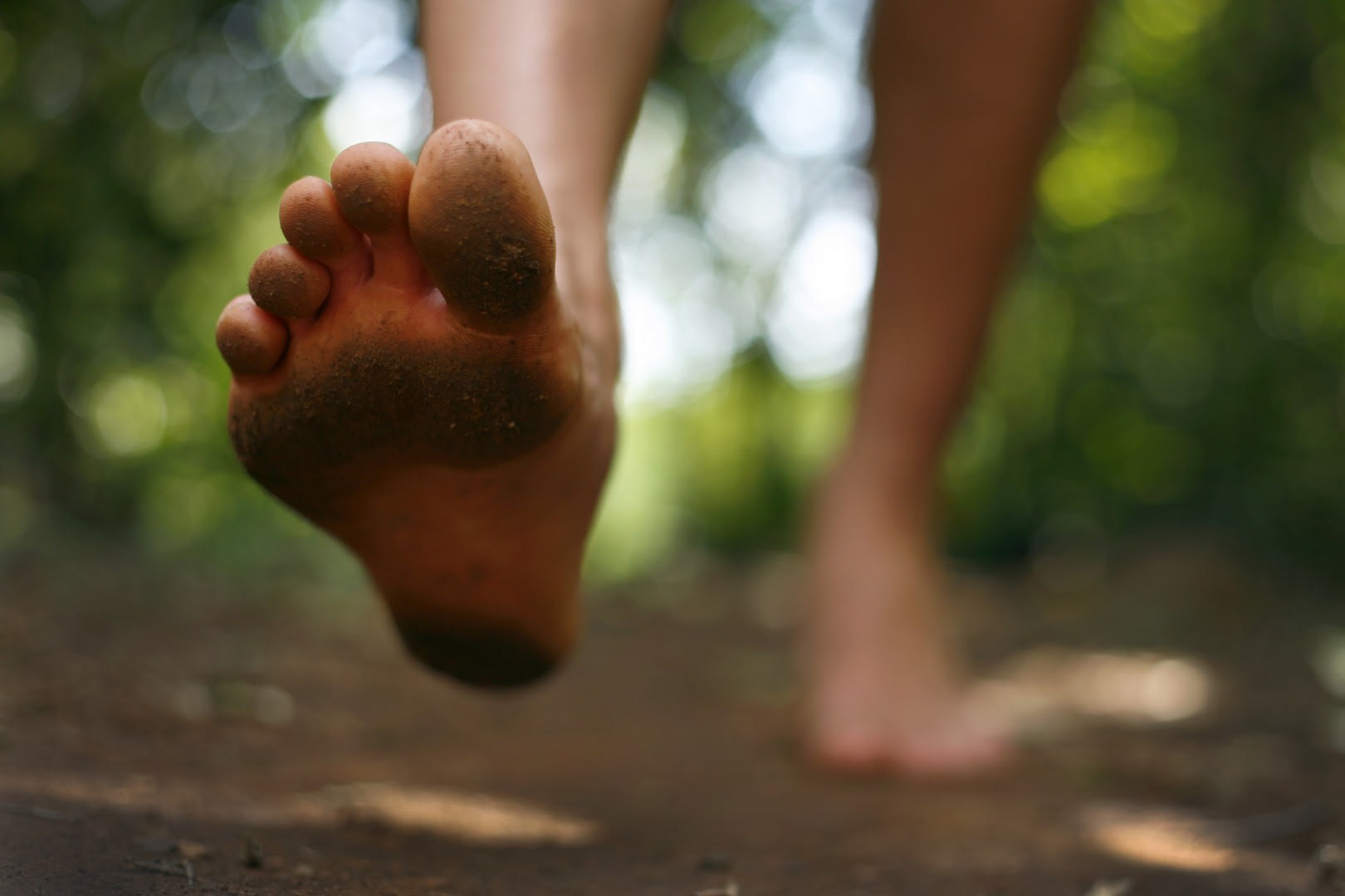 Page Turner June Crossing Bare Foot Young Man in Forest Trail